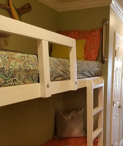 a view of a door with a painting on the wall