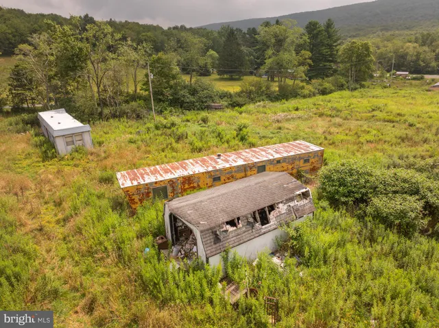 a view of a large body of water with a building in the background