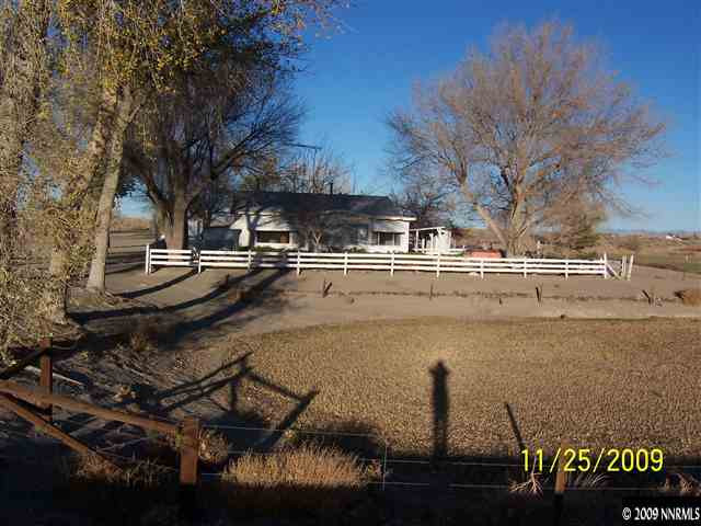 6820 Reno Highway Fallon, NV 89406 - Photo 1 of 9 a front view of a house with lake view
