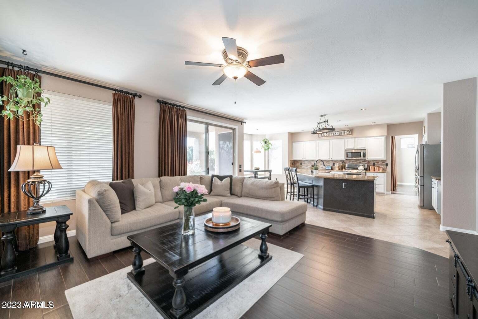 4621 East Kirkland Road Phoenix, AZ 85050 - Photo 13 of 32 a living room with furniture kitchen view and a large window