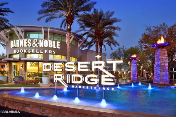 a view of swimming pool with outdoor seating