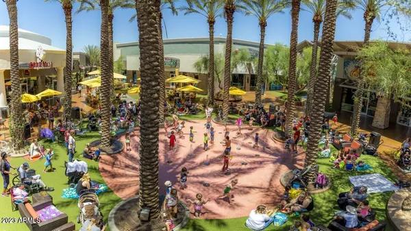 a view of outdoor space with lots of flowers and tree