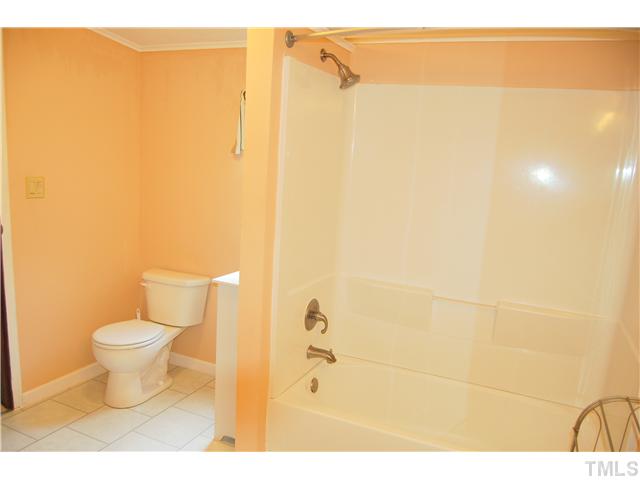 514 Dick Holeman Road Timberlake, NC 27583 - Photo 11 of 21 a bathroom with a toilet and a shower