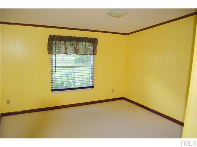 514 Dick Holeman Road Timberlake, NC 27583 - Photo 12 of 21 a view of an empty room with a window