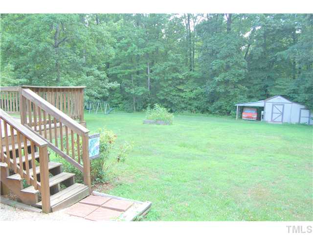 514 Dick Holeman Road Timberlake, NC 27583 - Photo 14 of 21 a view of a deck with a yard
