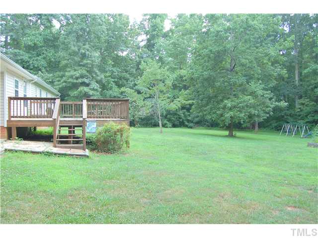 514 Dick Holeman Road Timberlake, NC 27583 - Photo 18 of 21 a view of a house with a backyard