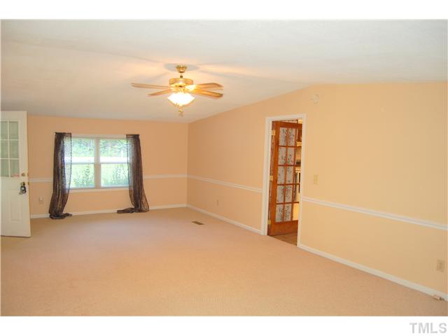514 Dick Holeman Road Timberlake, NC 27583 - Photo 6 of 21 a view of empty room with ceiling fan