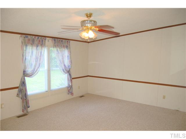 514 Dick Holeman Road Timberlake, NC 27583 - Photo 7 of 21 a view of an empty room with a window