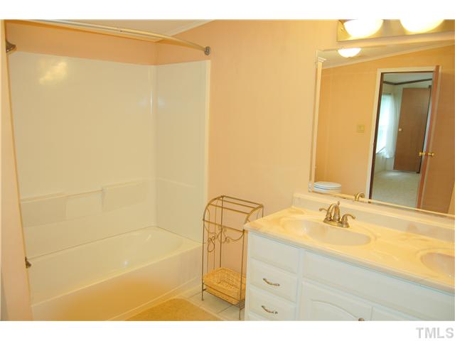 514 Dick Holeman Road Timberlake, NC 27583 - Photo 10 of 21 a bathroom with a shower and a sink