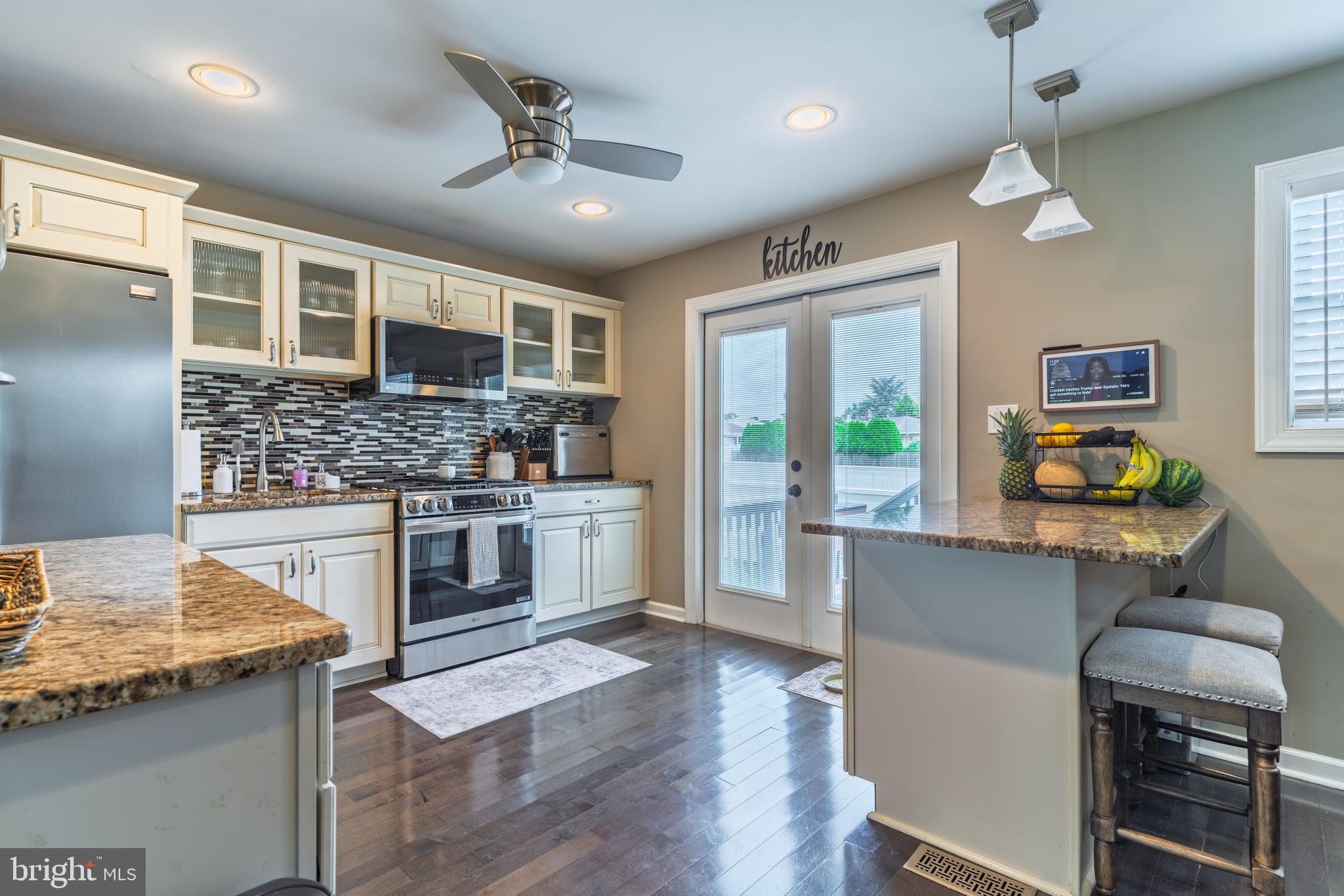 30 Rock Royal Road Hamilton, NJ 08620 - Photo 28 of 54 a kitchen with stainless steel appliances granite countertop wooden cabinets a stove top oven a sink and dishwasher