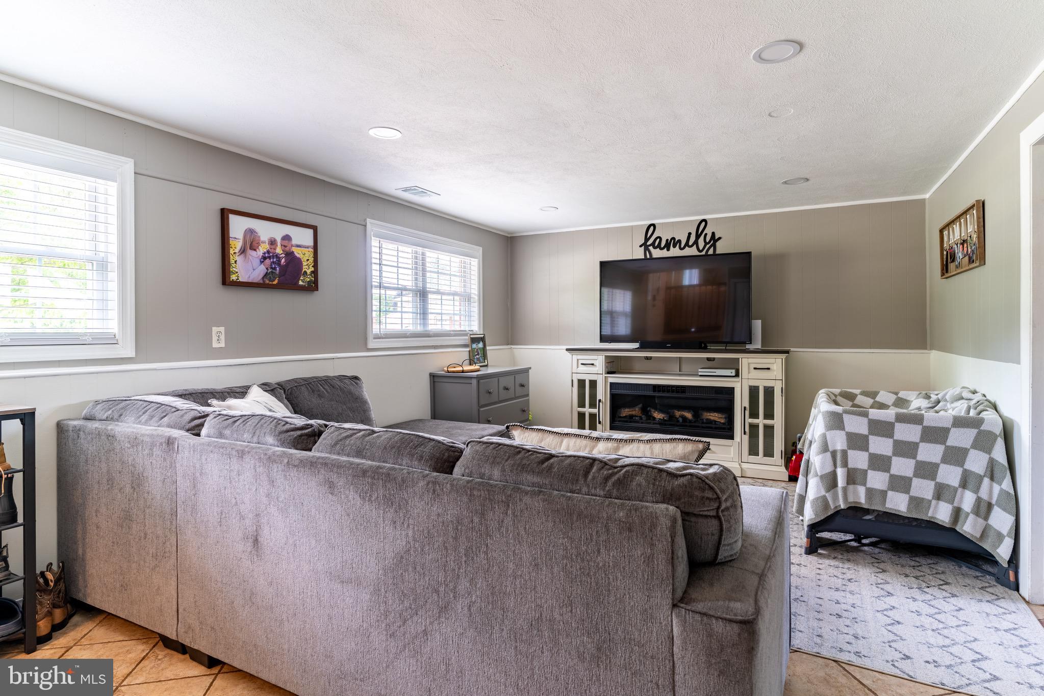 30 Rock Royal Road Hamilton, NJ 08620 - Photo 42 of 54 a living room with furniture and a flat screen tv