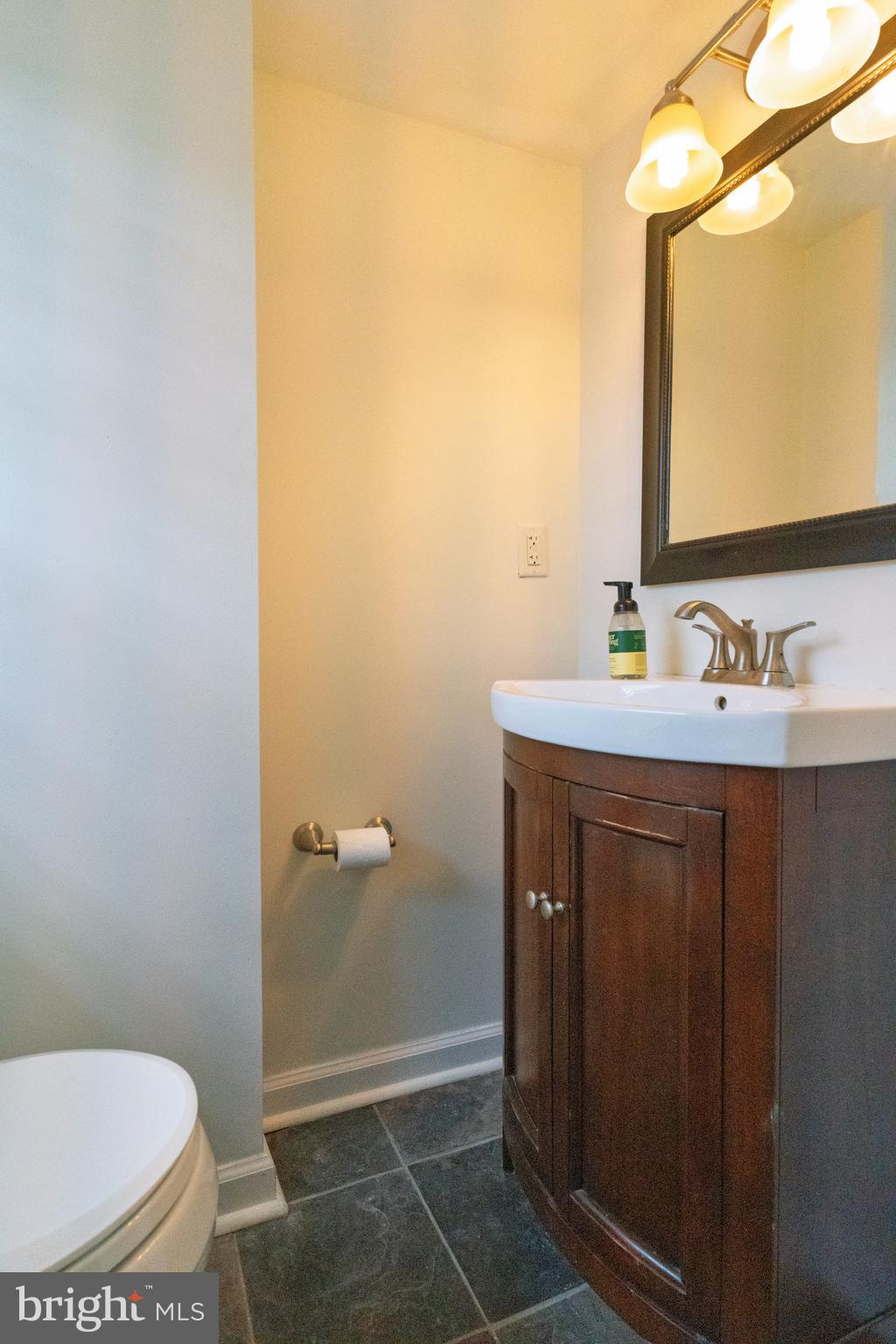 30 Rock Royal Road Hamilton, NJ 08620 - Photo 44 of 54 a bathroom with a sink and a mirror