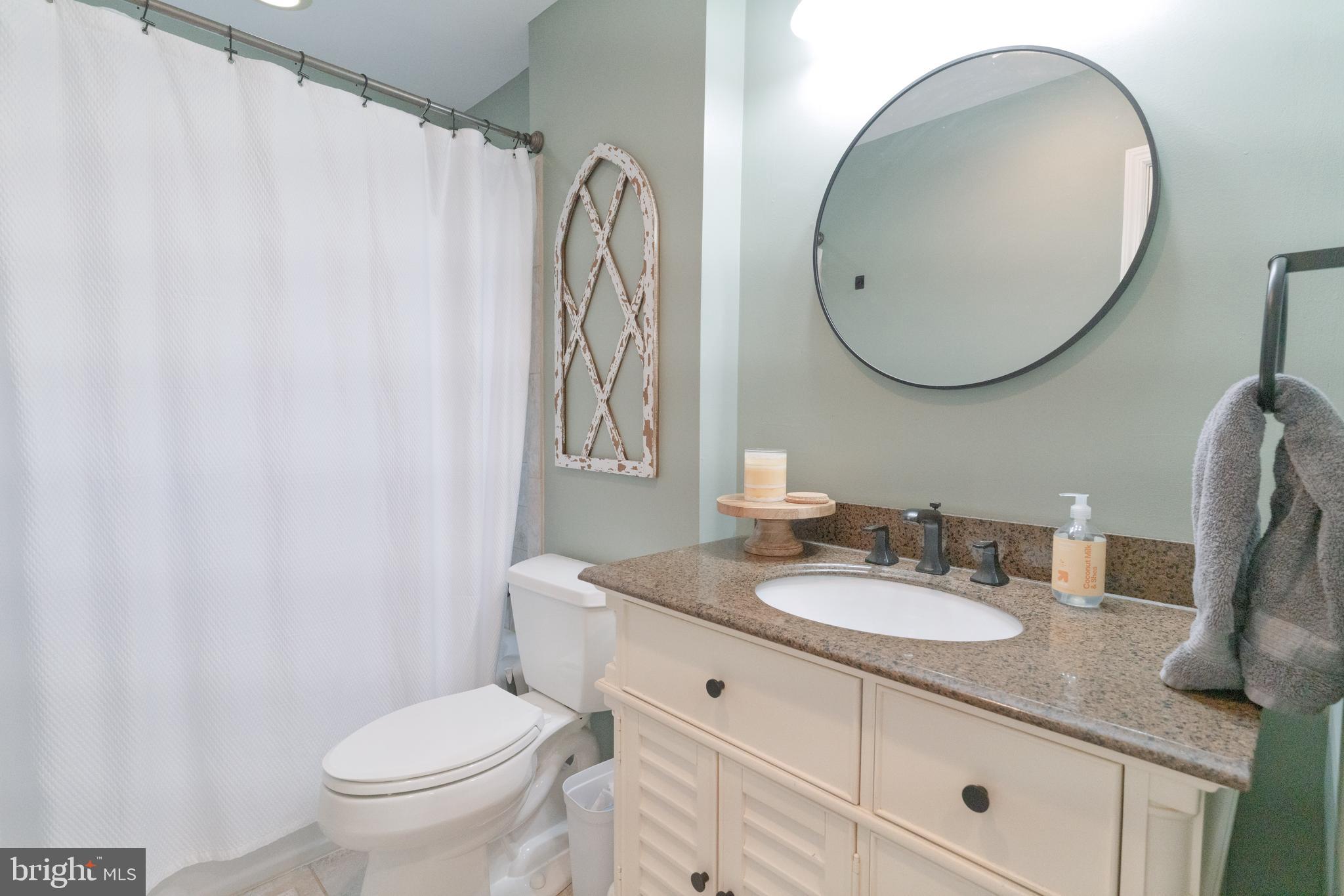 30 Rock Royal Road Hamilton, NJ 08620 - Photo 48 of 54 a bathroom with a granite countertop sink mirror vanity and toilet