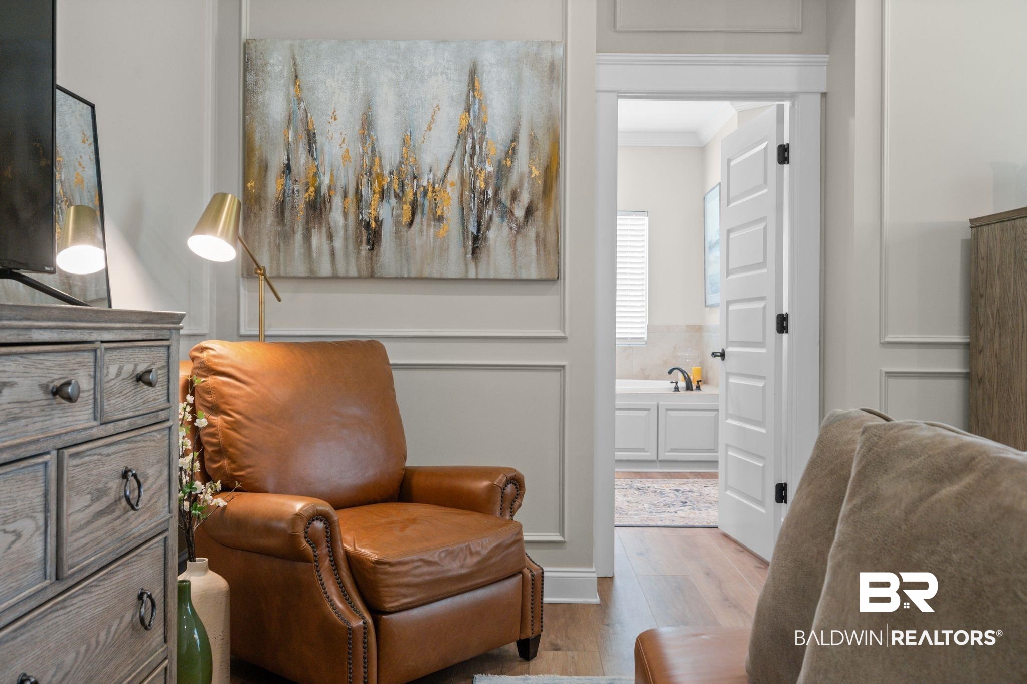 409 Fortune Drive Fairhope, AL 36532 - Photo 16 of 42 Wood-finish flooring with neutral wall tones and decorative panel molding