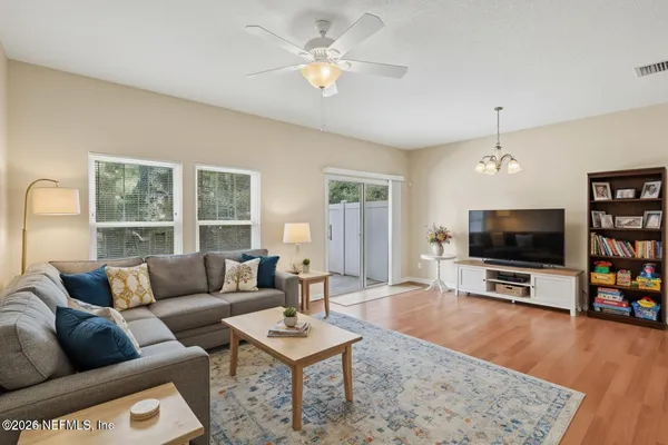 a living room with furniture and a flat screen tv