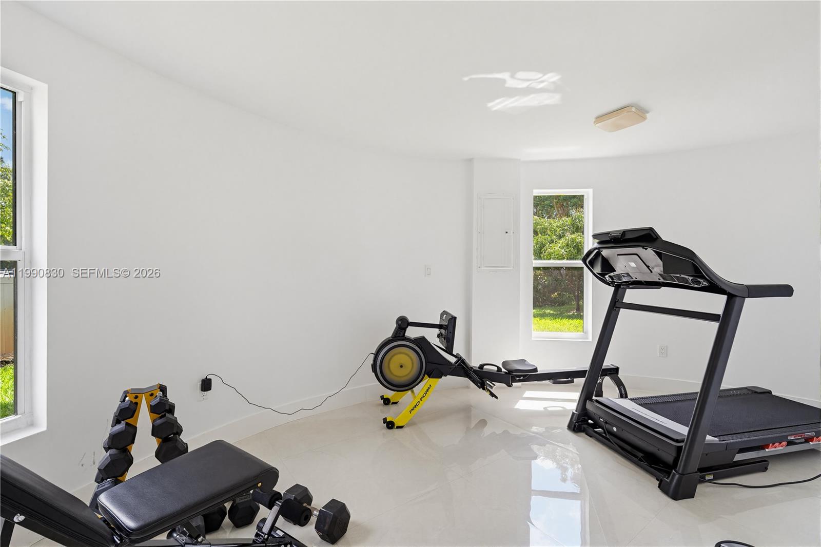 14401 Southwest 63rd Street Southwest Ranches, FL 33330 - Photo 71 of 81 a room with gym equipment and a window