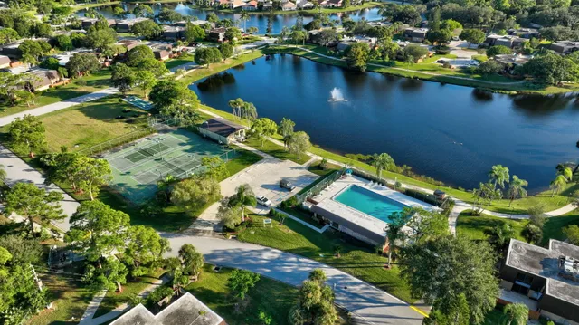 an aerial view of a house with a lake view