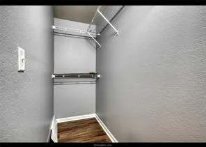 a bathroom with a sink a toilet and a shower