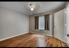 a bathroom with a granite countertop toilet sink and a mirror
