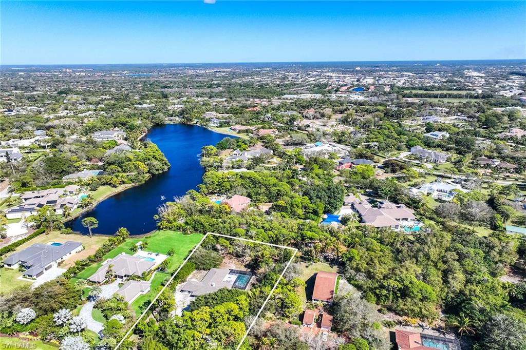 6574 Trail Boulevard Naples, FL 34108 - Photo 11 of 40 an aerial view of residential houses with outdoor space and trees