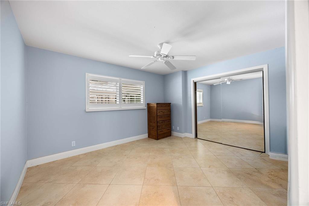 6574 Trail Boulevard Naples, FL 34108 - Photo 23 of 40 a view of an empty room with a window