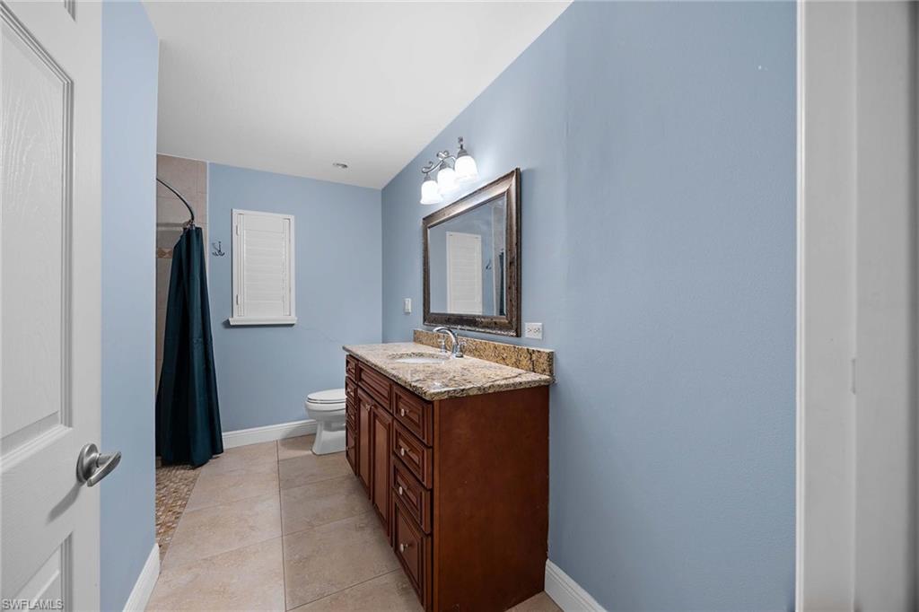 6574 Trail Boulevard Naples, FL 34108 - Photo 24 of 40 a utility room with washer and dryer