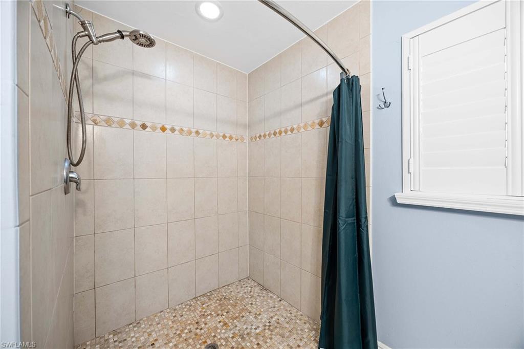 6574 Trail Boulevard Naples, FL 34108 - Photo 25 of 40 a bathroom with a shower