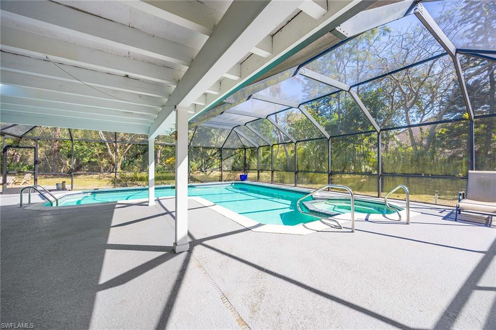 6574 Trail Boulevard Naples, FL 34108 - Photo 30 of 40 a view of house with yard and a slide