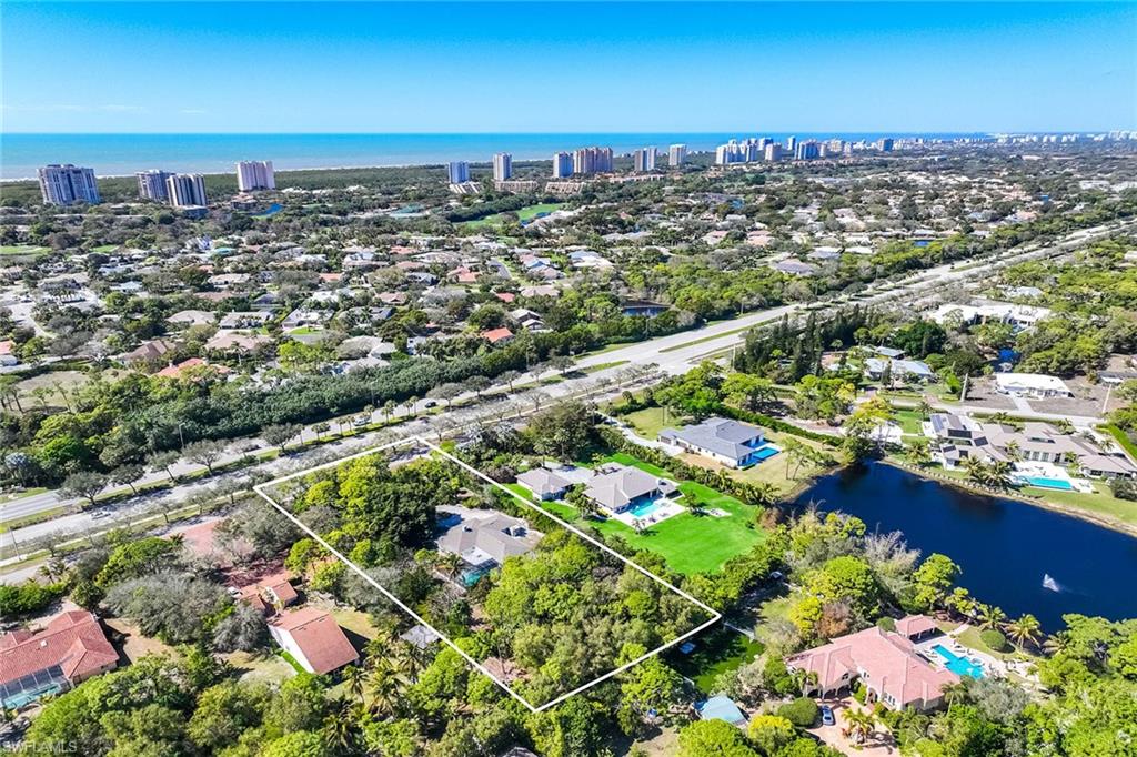 6574 Trail Boulevard Naples, FL 34108 - Photo 4 of 40 an aerial view of a city