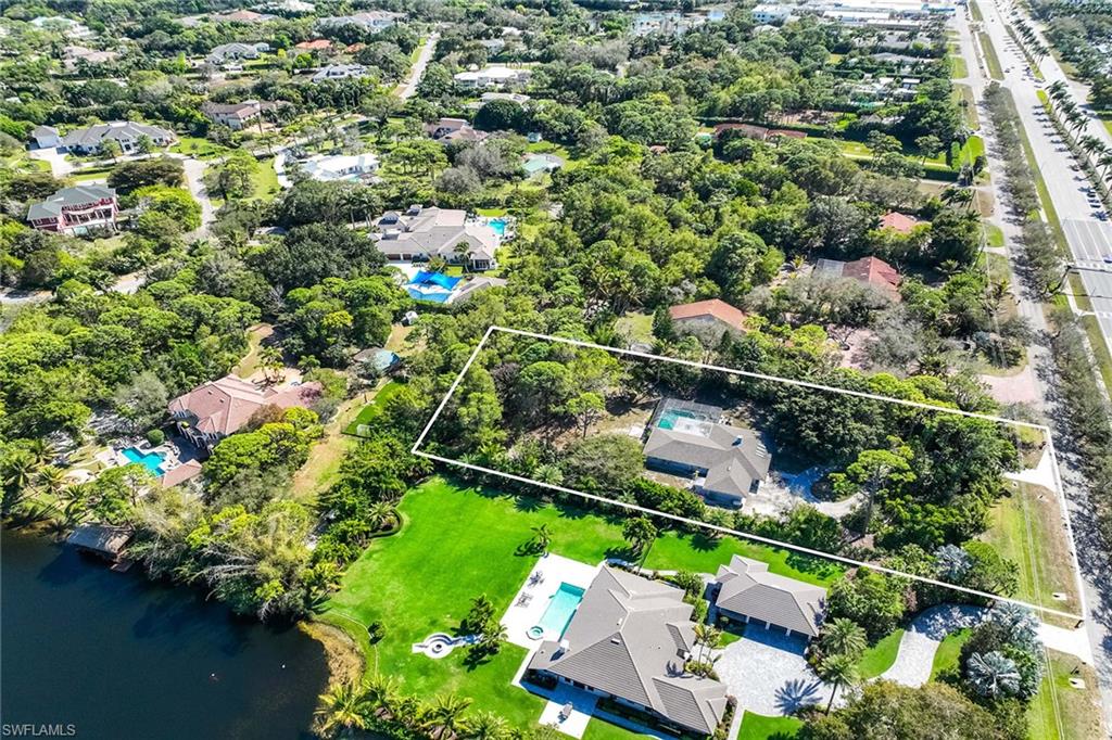6574 Trail Boulevard Naples, FL 34108 - Photo 7 of 40 an aerial view of residential house with outdoor space and trees all around