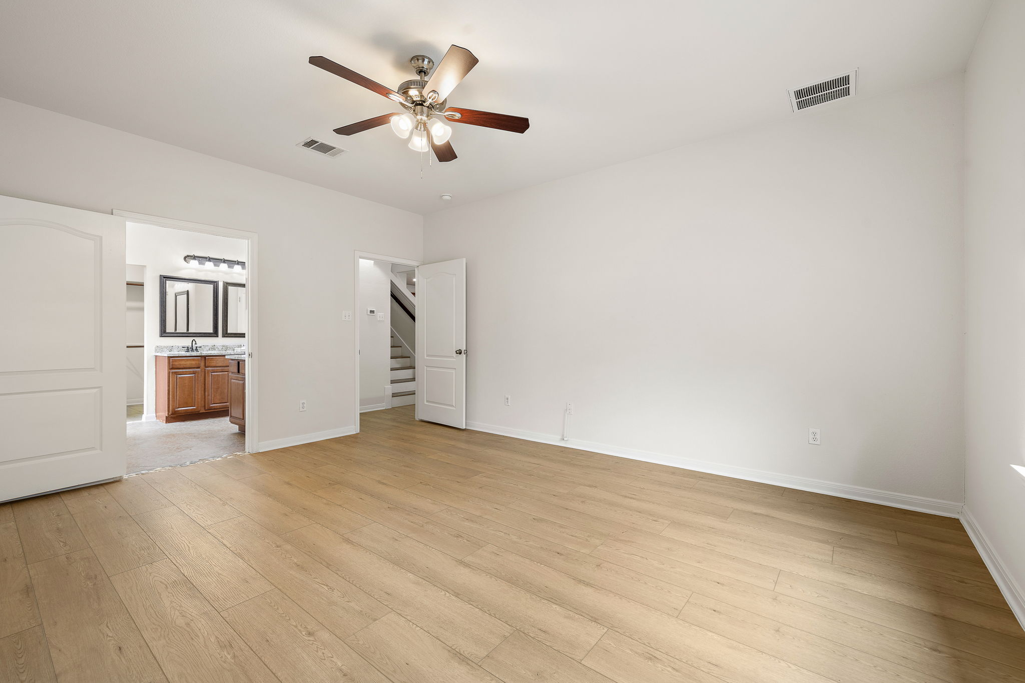 903 Fork Ridge Path Round Rock, TX 78665 - Photo 14 of 27 The primary bedroom with a generous ensuite.