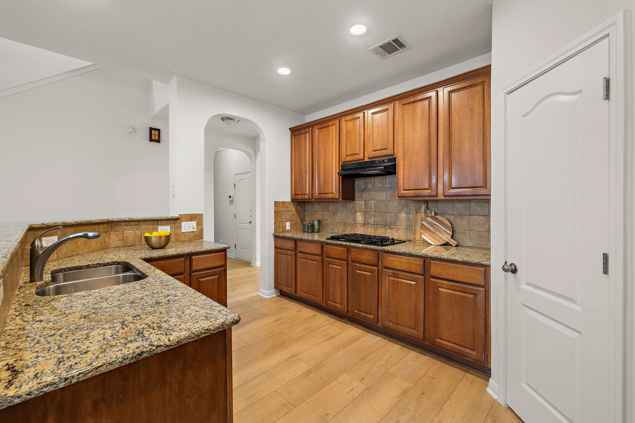 903 Fork Ridge Path Round Rock, TX 78665 - Photo 5 of 27 Kitchen with granite countertops and an under mount sink.