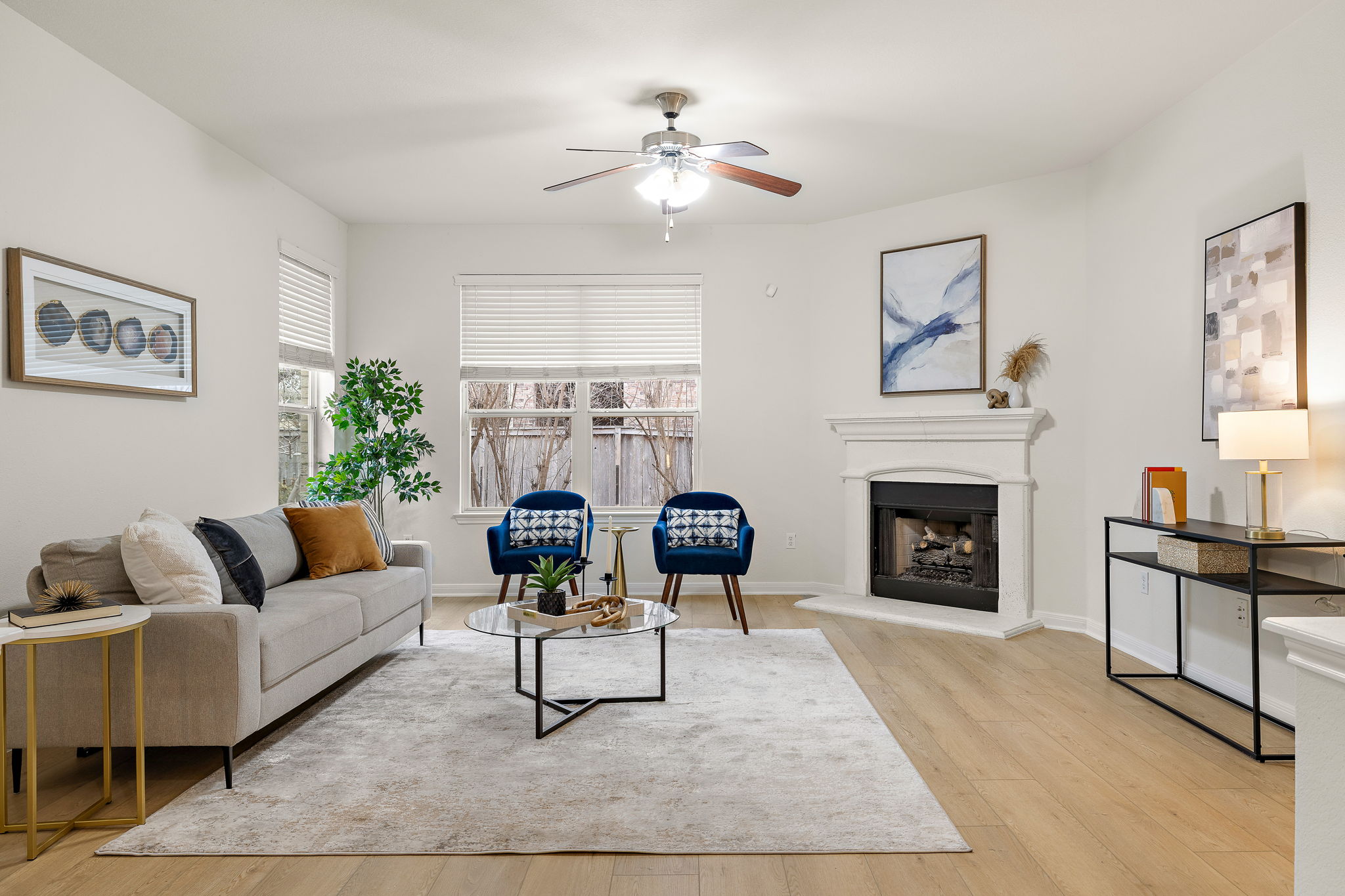 903 Fork Ridge Path Round Rock, TX 78665 - Photo 8 of 27 Family room with a fireplace, which is open to the kitchen area too.