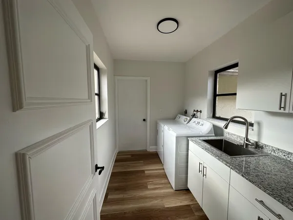 a kitchen with a sink and a refrigerator