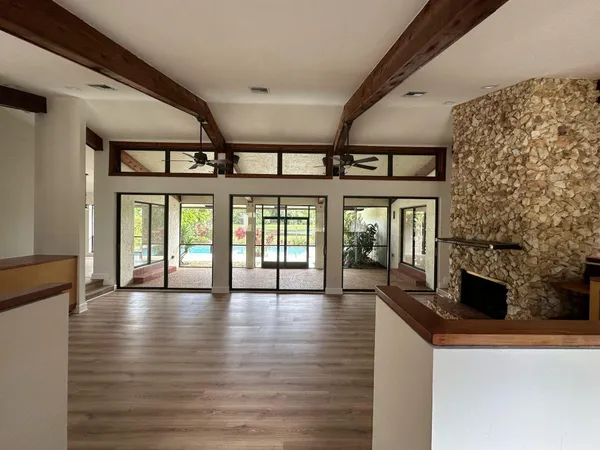 a view of an entryway with wooden floor