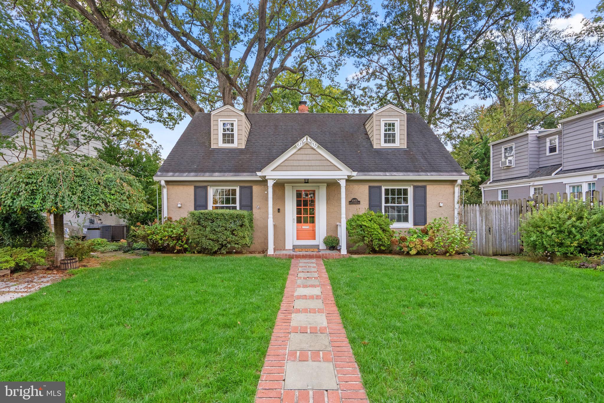 10603 South Dunmoor Drive Silver Spring, MD 20901 - Photo 1 of 41 a front view of a house with yard