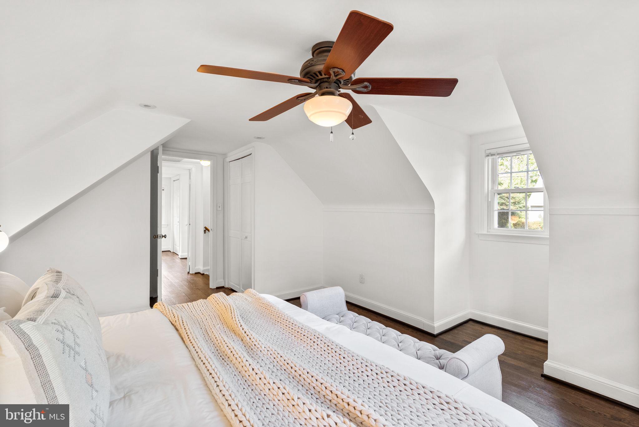 10603 South Dunmoor Drive Silver Spring, MD 20901 - Photo 22 of 41 a bedroom with a bed and a chandelier