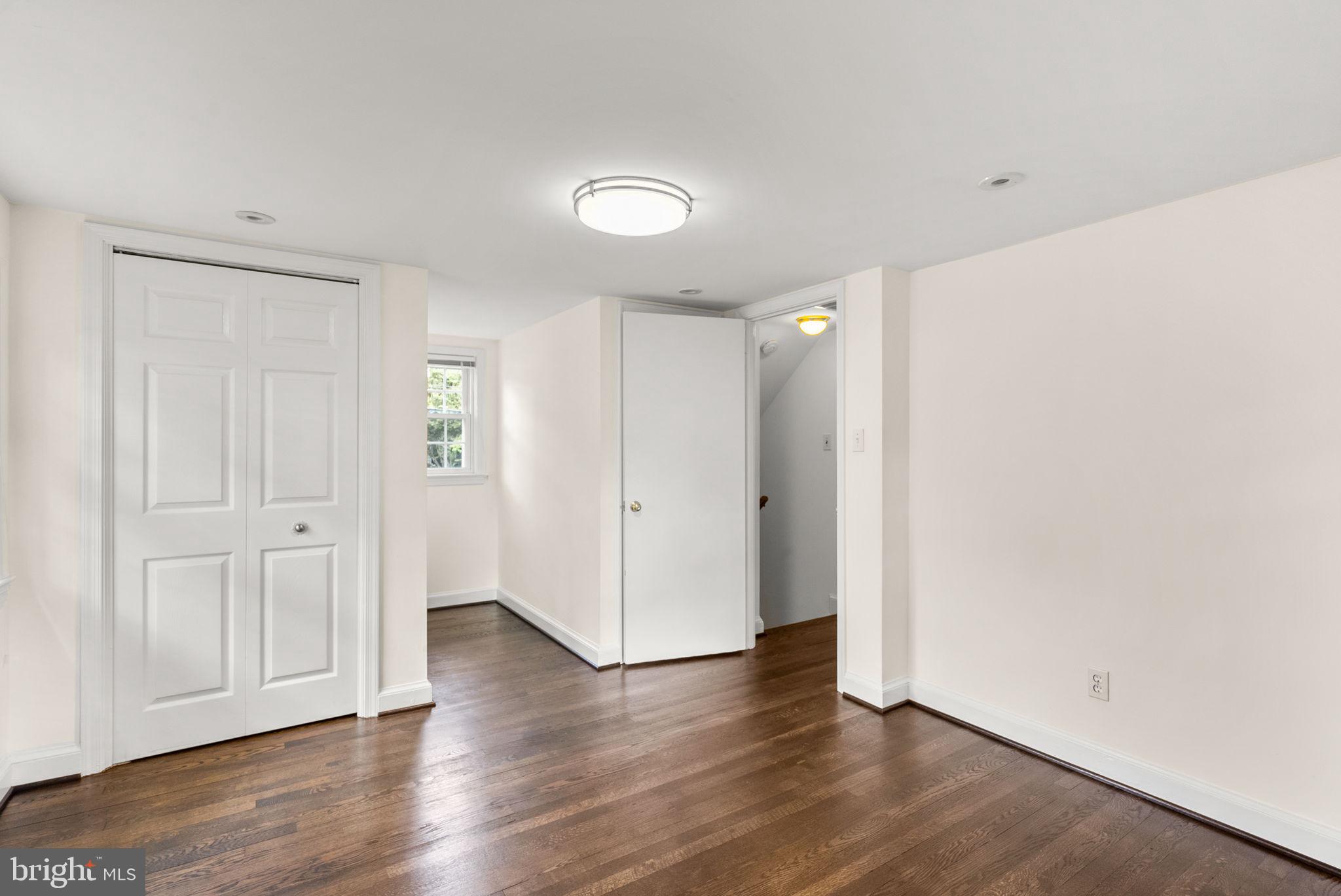 10603 South Dunmoor Drive Silver Spring, MD 20901 - Photo 24 of 41 a view of an empty room with wooden floor