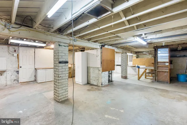 a view of empty room with wooden ceiling