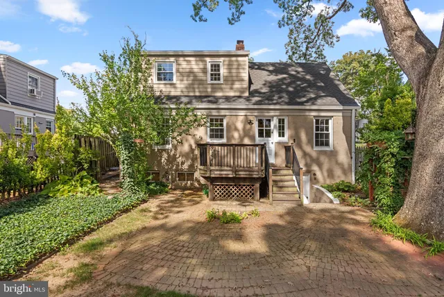 front view of house with a yard and sitting area