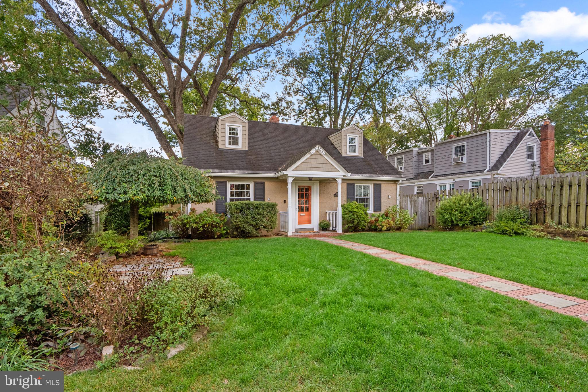 10603 South Dunmoor Drive Silver Spring, MD 20901 - Photo 36 of 41 a front view of a house with yard and green space