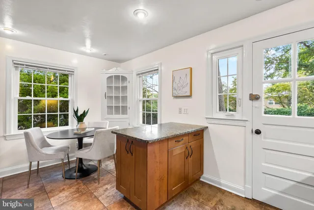 a living room with furniture and windows