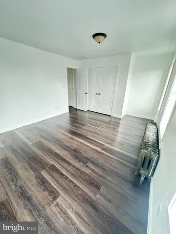 a view of a livingroom with wooden floor