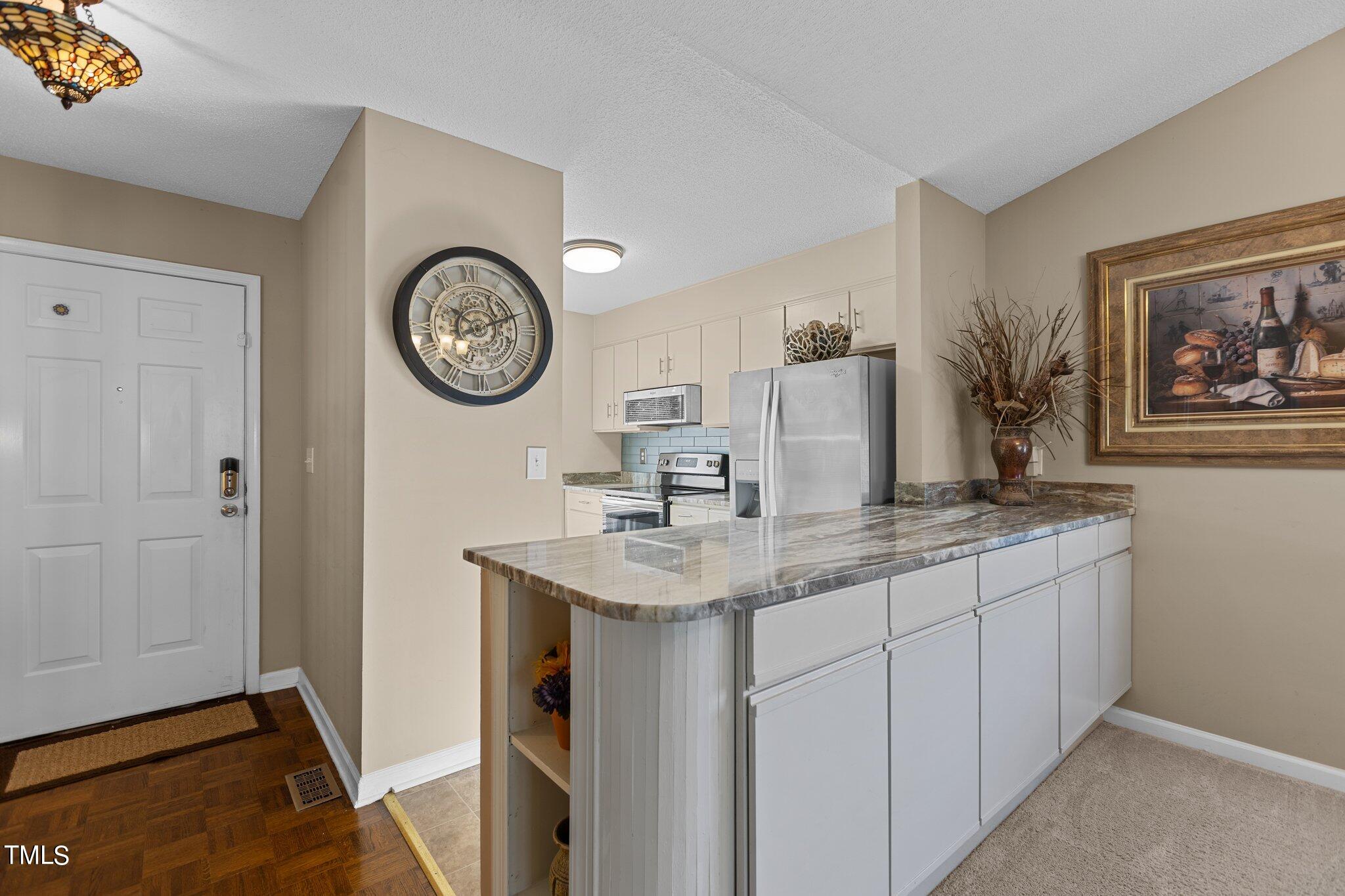 2426 Mapleton Lane Raleigh, NC 27613 - Photo 12 of 30 Kitchen Island with cabinet space