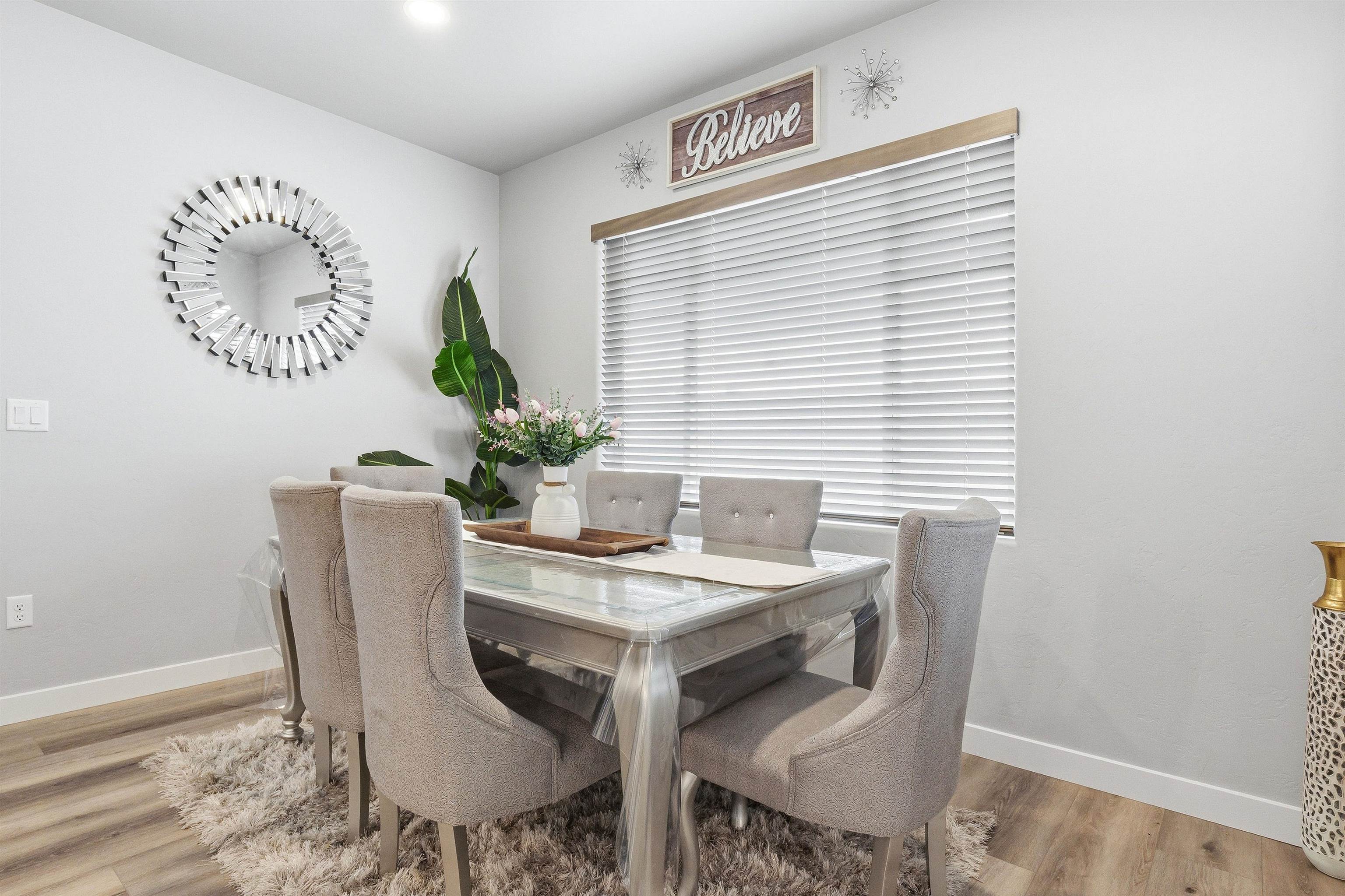 2459 Hamilton Road, Unit A Grand Junction, CO 81505 - Photo 9 of 27 a view of a dining room with furniture and a potted plant