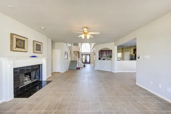 a view of a livingroom with an empty space and a fireplace