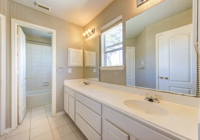 a bathroom with a shower curtain and a curtain