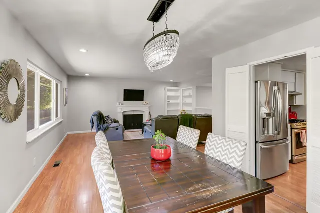 a kitchen with stainless steel appliances a refrigerator and a stove top oven