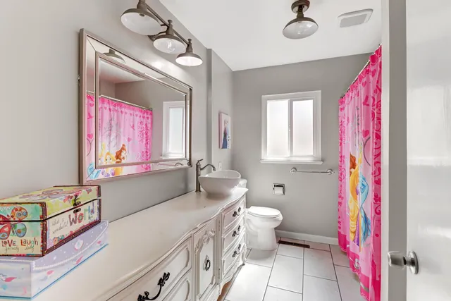 a living room with furniture a rug and a wooden floor