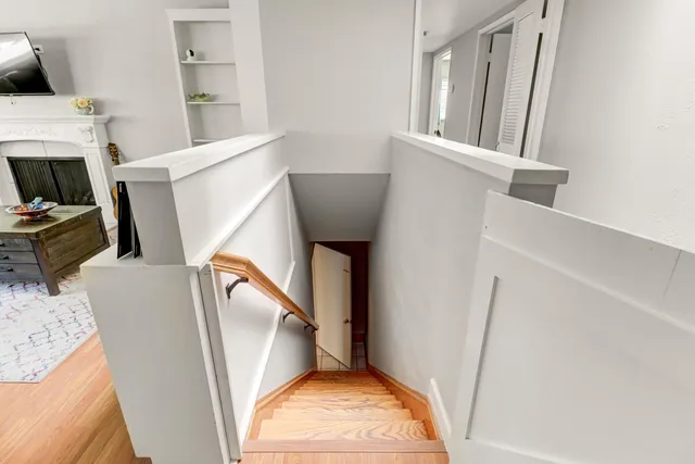 a room with furniture pool table and window